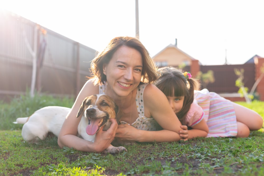 Happy dog mom hugging her golden retriever while wearing a custom hoodie.